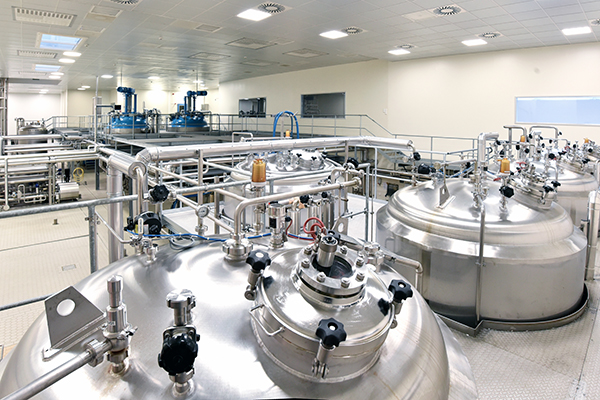 Interior of an industrial plant - pipelines, tank for storage